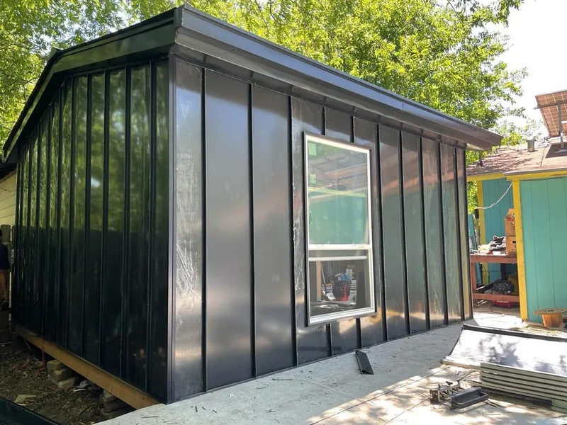 Black standing seam metal wall panels for Roof Inspection in Dighton